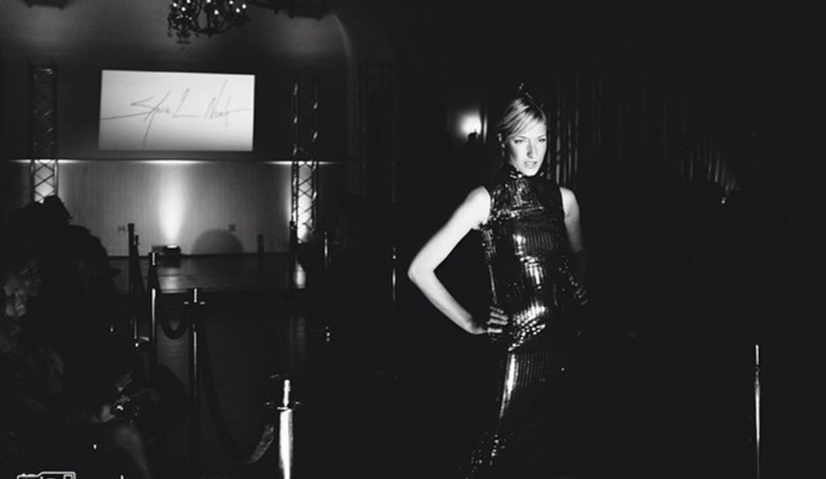 A woman model on the runway during a fashion show.