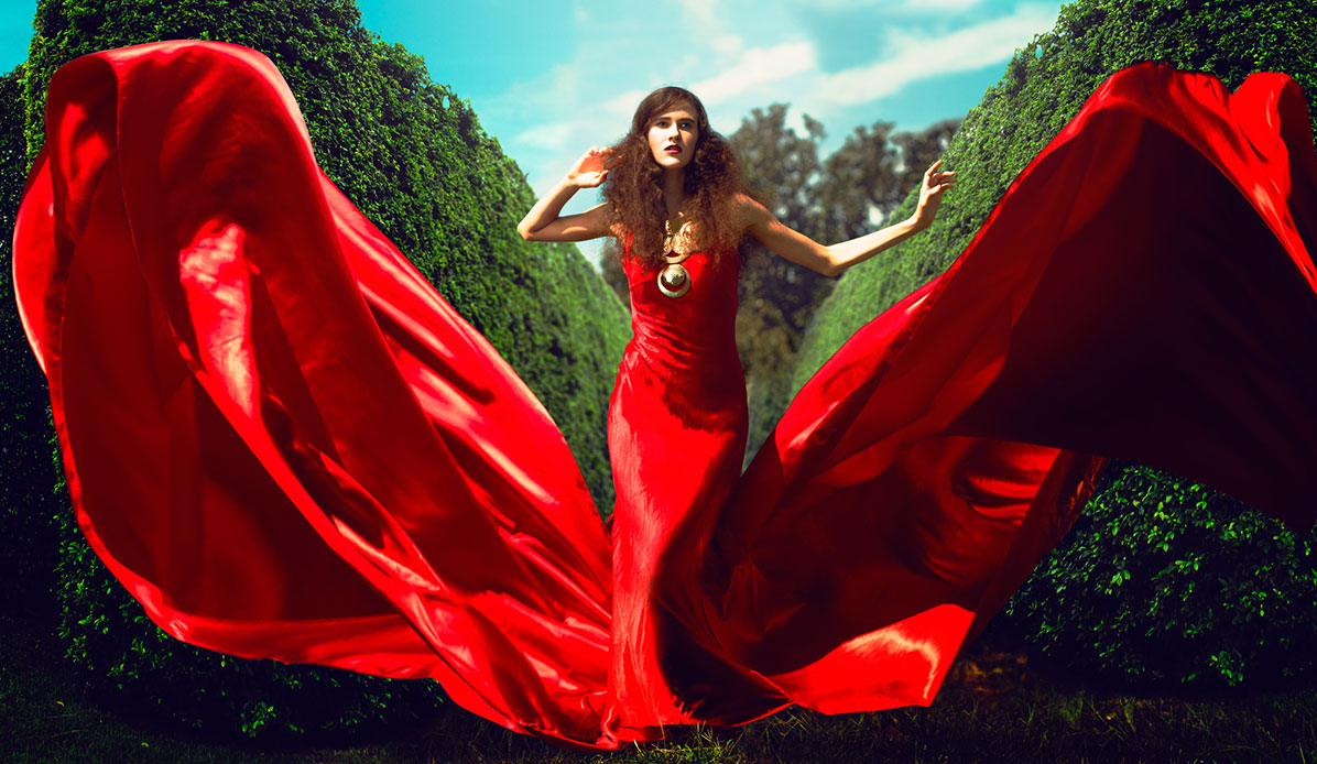 A woman in a flowing red gown.