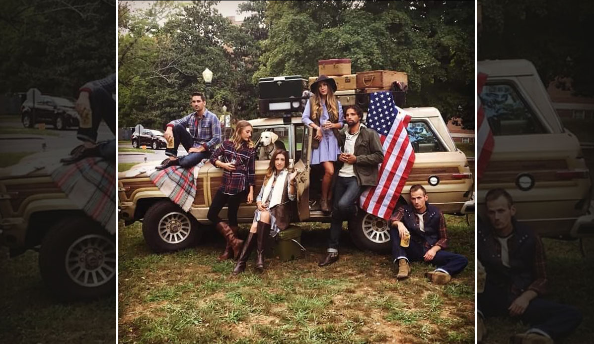 Young adults pose by a Jeep for a fashion ad.