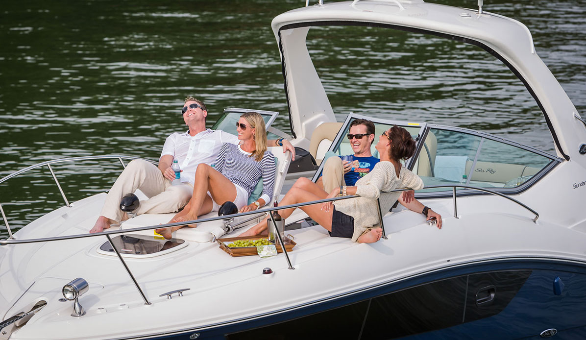 Models on a boat during a photo shoot.