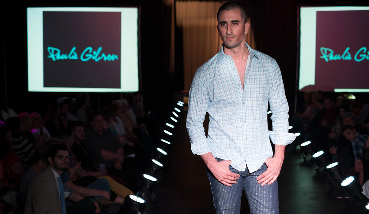 A male model in jeans and a button-down shirt.